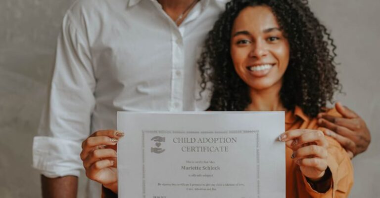Certifications - A Couple Holding an Adoption Certificate
