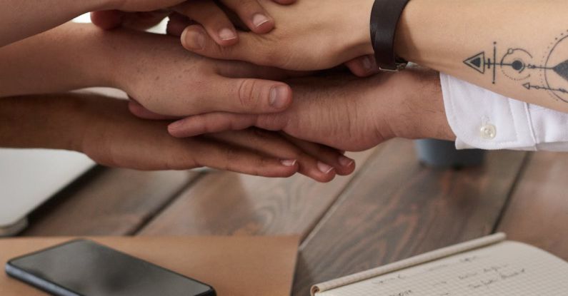 Team Communication - Photo Of People Near Wooden Table